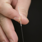 Thin, sterile, stainless steel acupuncture needle